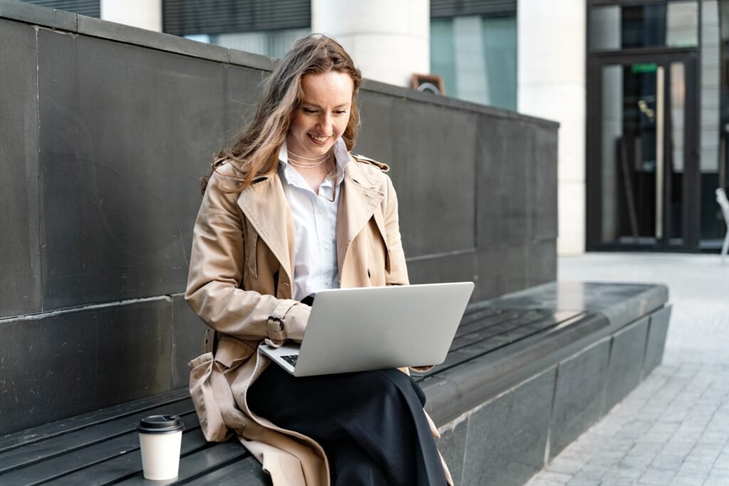 young specialist in commercial real estate works online. A happy contented young woman