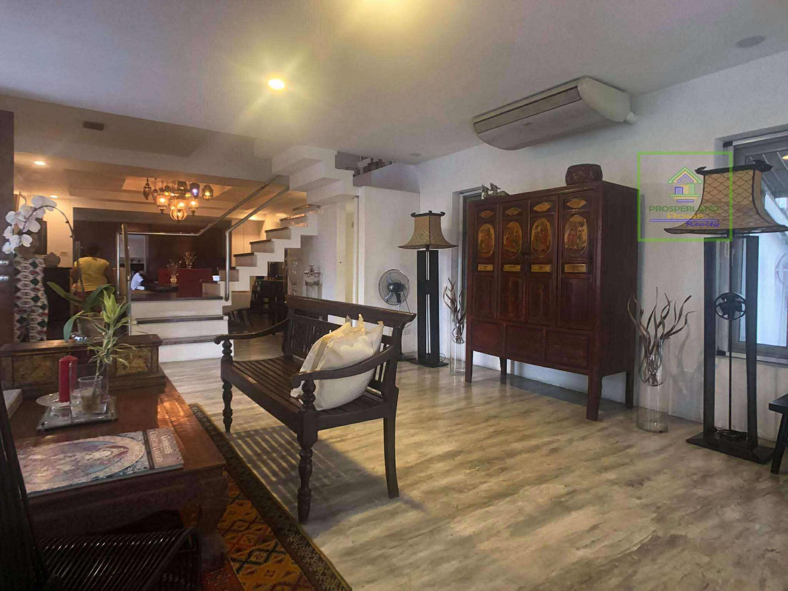 Interior view of an elegant living room with Asian-inspired decor.