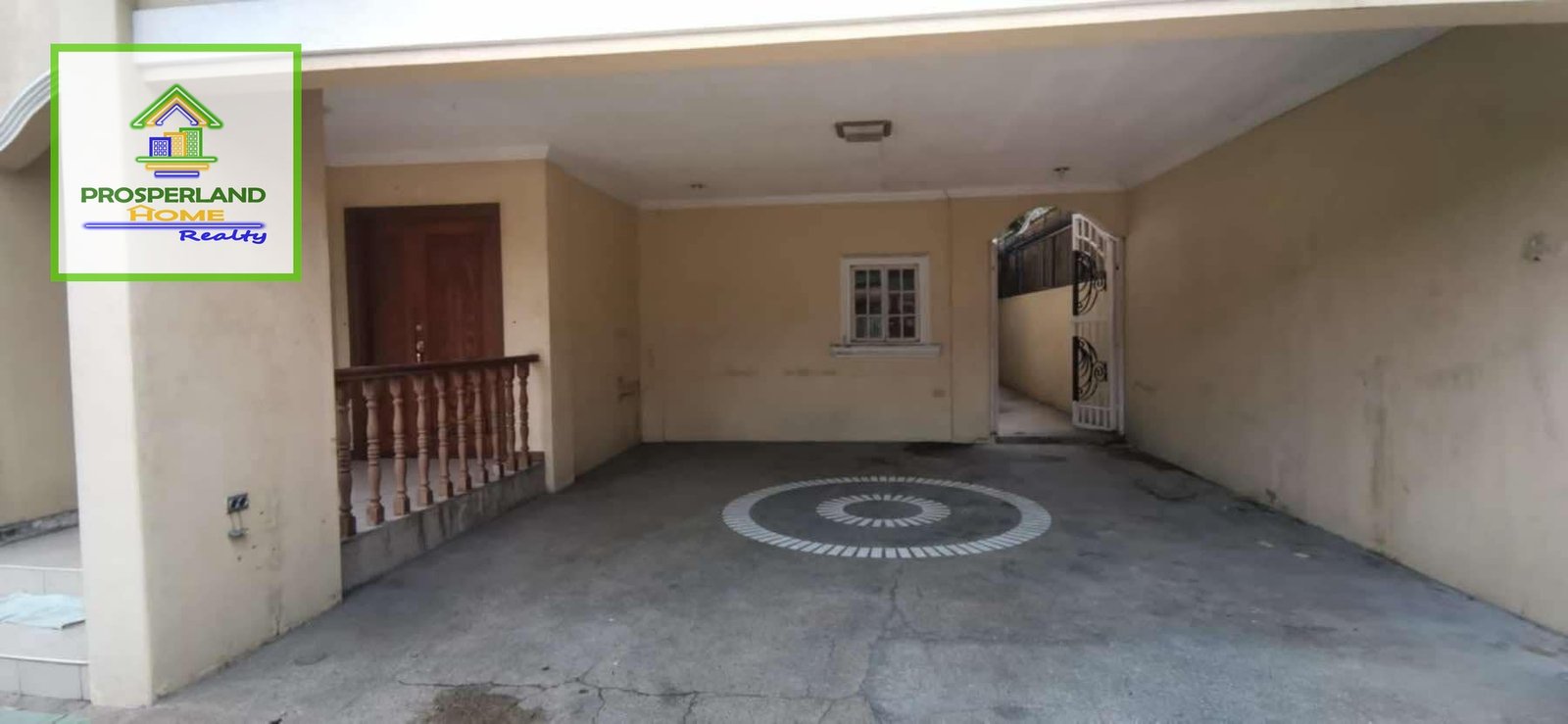Covered parking area with a Prosperland Home Realty logo.