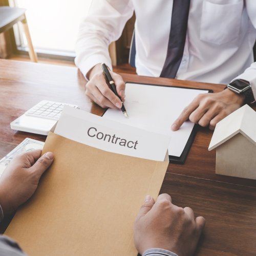 Business Signing a Contract Buy - sell house