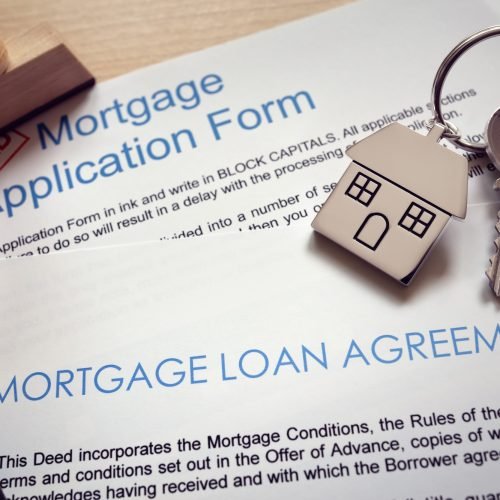 Mortgage application loan agreement and house key