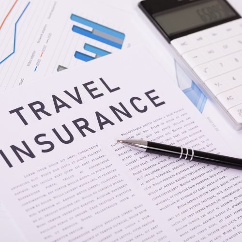 travel insurance concept, documents on the desktop